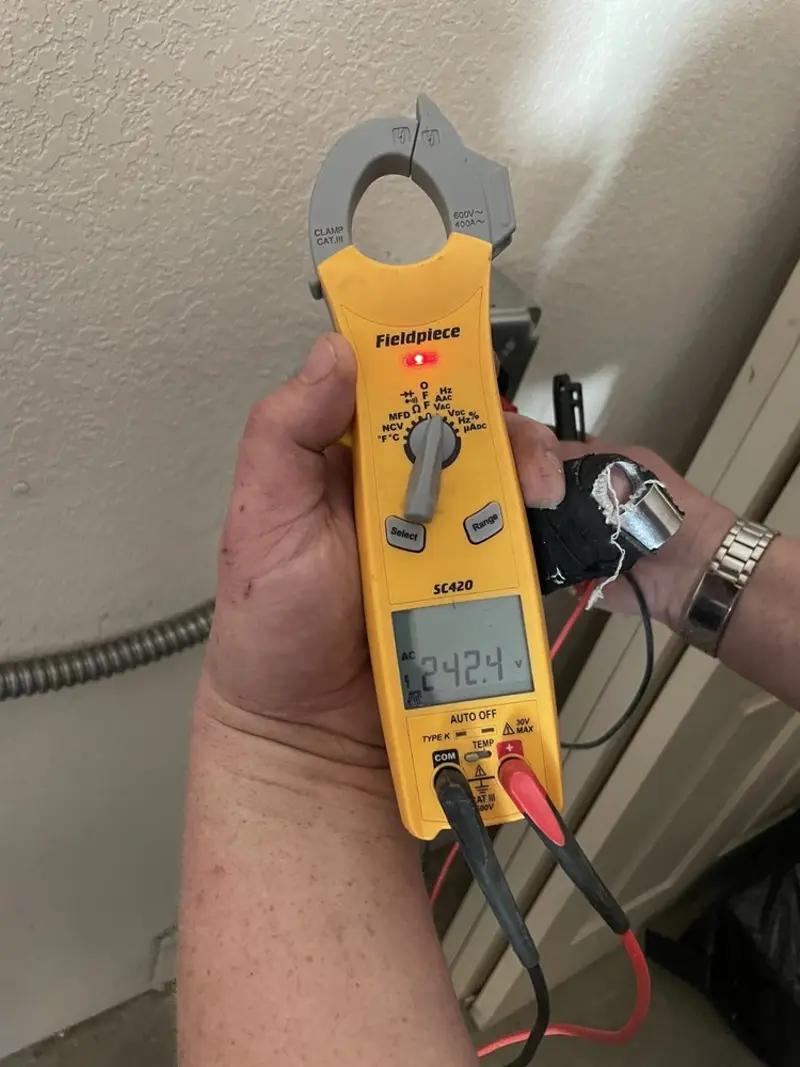 Voltage testing with clamp meter during Outlet Installation in Kingman